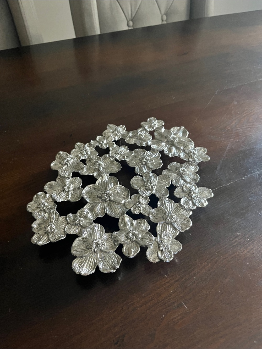 White orchid trivet Michael Aram